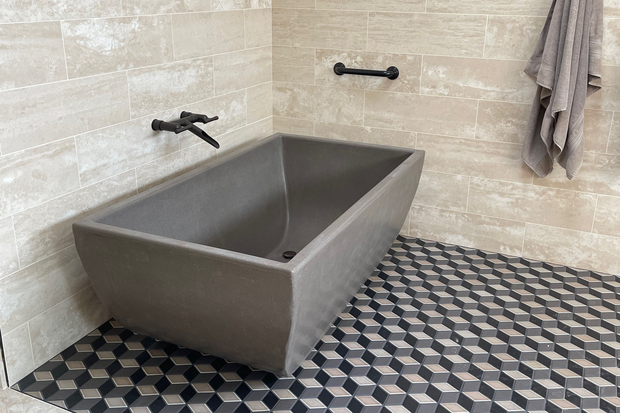 The Indulge Concrete Soaking Tub, MetalCrete Pewter Finish (Exterior Only)